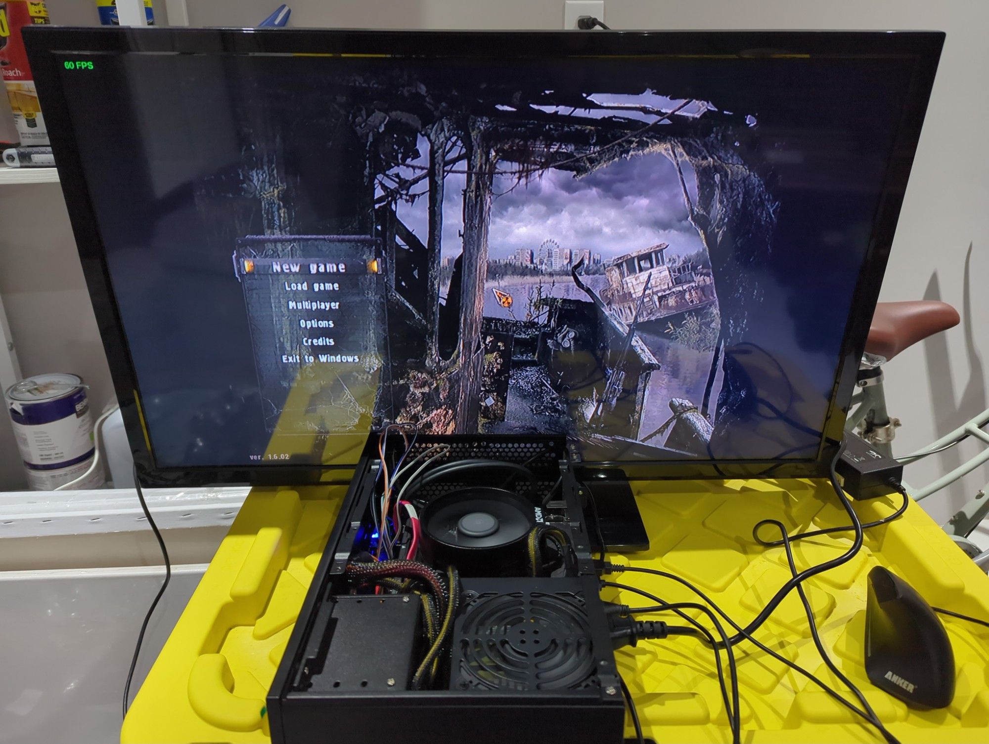 The box assembled, running S.T.A.L.K.E.R. Call of Pripyat in the garage atop a plastic box